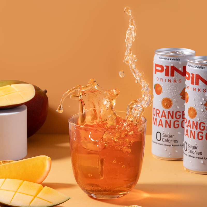 PIN Drinks Orange Mango - A vibrant blend of orange and mango for a delightful taste sensation. Sugar-free, calorie-free, preservative-free, colorant-free, plant-based, gluten-free, and vegan beverage.